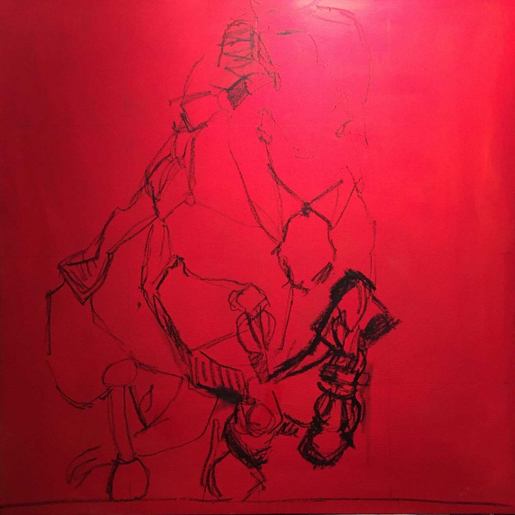 Red canvas with beginning of painting in dark paint